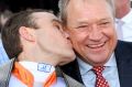 Tony McEvoy is kissed by Luke Currie after their Australian Guineas success.