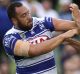 Stink: Sam Kasiano and Will Chambers grapple at Belmore Sports Ground.