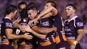 Captain courageous: New skipper Darius Boyd (centre) inspired the Broncos to a gritty win against Cronulla. 