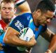 GOLD COAST, AUSTRALIA - MARCH 04: Jarryd Hayne of the Titans is tackled during the round one NRL match between the Gold ...