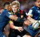 Speed to burn: Damian McKenzie enters the fray at Rugby Park in Hamilton.