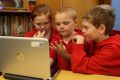 School children work off a computer at Darlington Public School. 