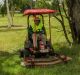 Mower operator Alex Ollson (with the Transport Canberra and City Services Directorate) works extra hard to cut long ...