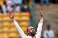 Nathan Lyon appeals successfully for the wicket of India's captain Virt Kohli.