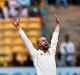 Nathan Lyon appeals successfully for the wicket of India's captain Virt Kohli.