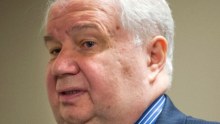 Russian ambassador to the US Sergey Kislyak standing in a suit.