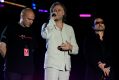 Midge Ure (left) with Bob Geldof, and Bono. Ure and Geldof together created Band Aid and Live Aid.