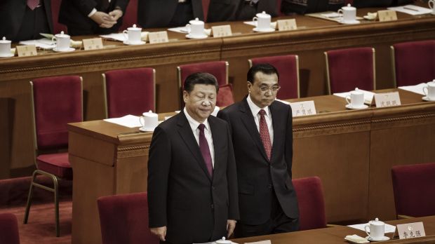 Xi Jinping, China's president, left, and Li Keqiang, China's premier, arrive during the opening of the fifth session of ...