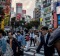 Pedestrians cross the road at Japan's famous Shibuya crossing.