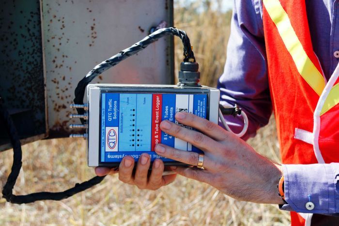 A close up of a traffic logging device, which resembles a VHS tape.