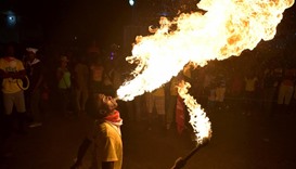 A fire-swallower performs in the third and final day of Carnival in the capital of Haiti, Port-au-Pr