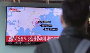 A man watches a TV news program reporting about North Korea's missile firing at Seoul Train Station in Seoul, South Korea, Monday, March 6, 2017.