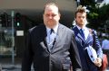 Former Queensland MP Scott Driscoll approaches Brisbane District Court for his sentencing on fraud charges. 