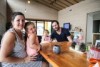 Sandie and Joshua Richmond from Birchip sitting at the dining table with their two children Sienna (left) and Ari (right).