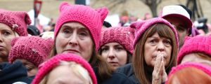 Women in "pussy hats" listen to speakers at the Women's March on Washington in January. 