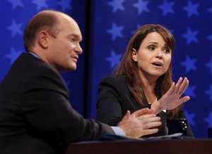 Democratic candidate Chris Coons and Republican candidate Christine O'Donnell, right, respond to a question during a televised Delaware Senate debate at the University of Delaware in Newark, Del., Wednesday, Oct. 13, 2010.