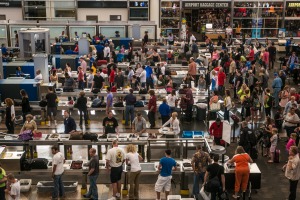 Passengers queue at TSA security lines at Denver International Airport.