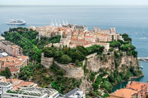 Monaco - it's tiny and shares its border with only one other country.