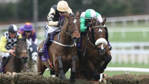 Hidden Cyclone (on the right) clears a hurdle for Danny Mullins alongside Ruby Walsh on Bonbon Au Miel