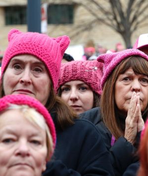 Women in "pussy hats" listen to speakers at the Women's March on Washington in January. 