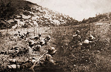 Photograph of Bulgarian soldiers cutting enemy barbed wire during World War I: Bulgarian soldiers cutting barbed wire laid by the Entente Powers and preparing to advance.