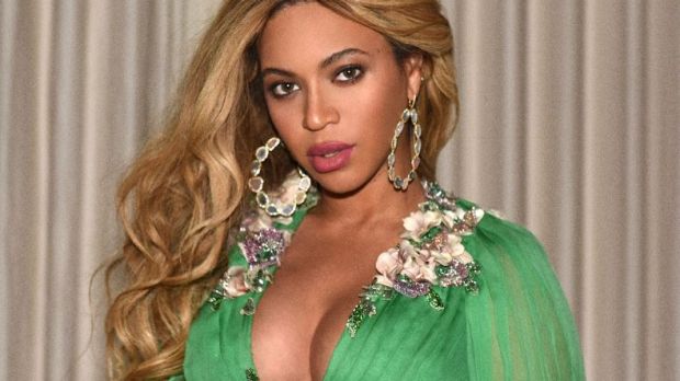 Beyonce and Blue Ivy coordinate in $60k green Gucci gowns for premiere.