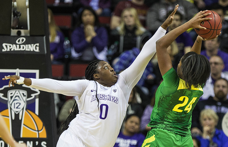 Chantel Osahor goes after the shot by Oregon’s Ruthy Hebard in the 1st half.  The 3-seeded Washington Huskies played the 6-seeded Oregon Ducks in the quarterfinals of the Pac-12 Women’s Basketball Tournament Friday, March 3, 2017.