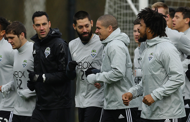 FILE – In this Jan. 24, 2017 file photo, Seattle Sounders players, including forward Clint Dempsey, center-left, and team captain midfielder Osvaldo Alonso, cener-right, jog during the first training session of the 2017 MLS soccer season, in Tukwila, Wash. Dempsey is scheduled to return to the team from an extended absence due to a heart issue for the 2017 MLS soccer season, which, along with winning the 2016 MLS Cup, will bring a new chapter for the Sounders as they begin play facing the challenge of a short offseason. (AP Photo/Ted S. Warren, File)