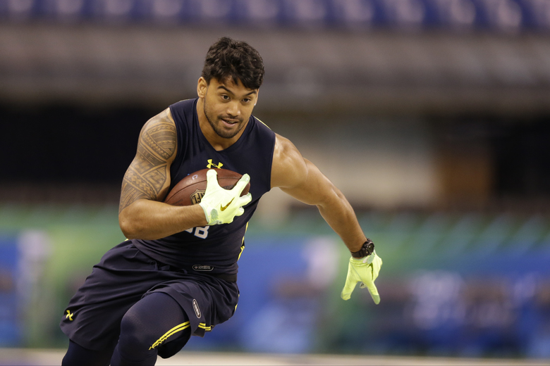 Washington State defensive back Shalom Luani runs a drill at the NFL football scouting combine in Indianapolis, Monday, March 6, 2017. (AP Photo/Michael Conroy) INMC10 INMC10