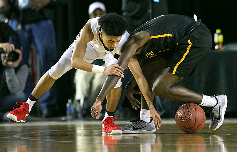 Tajon Williams of Nathan Hale, left, and Le’Zjon Bonds of Lincoln, right, battle for control of a loose ball. Nathan Hale won 84-60.

Nathan Hale played Lincoln in the 3A boys semifinals of the Hardwood Classic on Friday, March 3, 2017, at the Tacoma Dome.