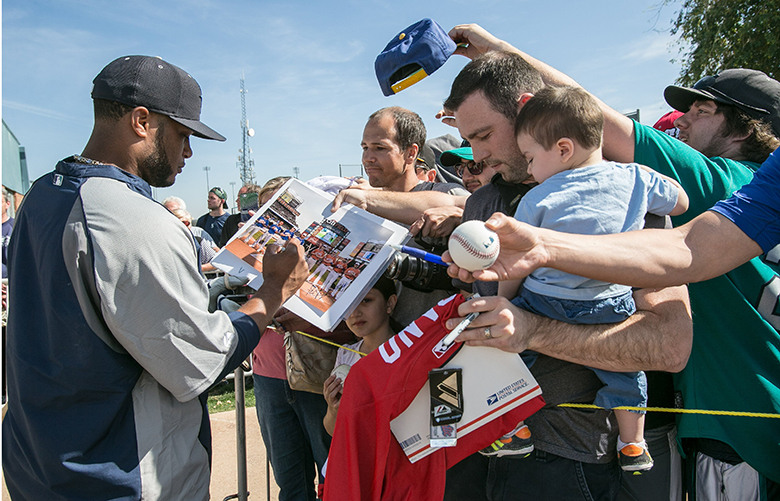 022214 – PEORIA, AZ – Robinson Cano signs for fans Saturday at Mariners Spring Training in Peoria, AZ.
(mariners23)
(stone23)