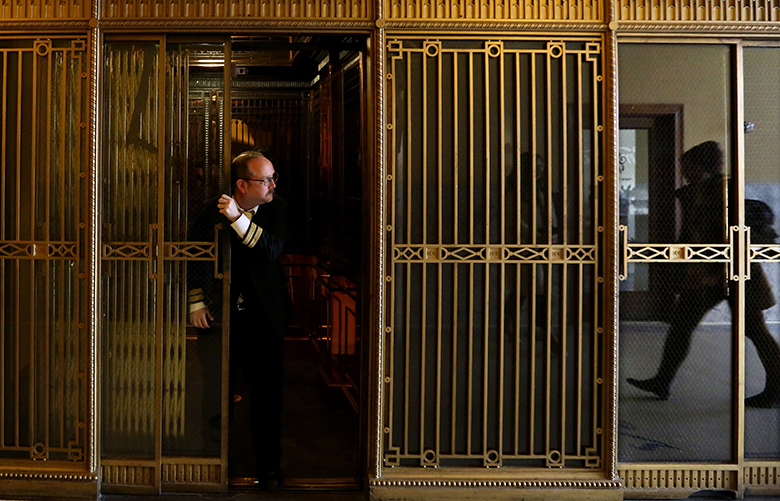 Greg Highsmith waits for a passenger coming the bank of seven manually-operated Otis elevators in Smith Tower built in 1914.   (These are the original Otis cars)



Smith Tower in Pioneer Square, completed in 1914.
It’s 42-stories tall and the first skyscraper west of the Mississippi River.  Thursday Feb 2, 2017