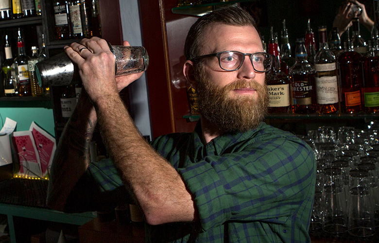 Mark Paschal, bar manager at Jude’s Old Town in Rainier Beach, makes one of the bar’s classic margaritas — with pineapple serrano infused  tequila.