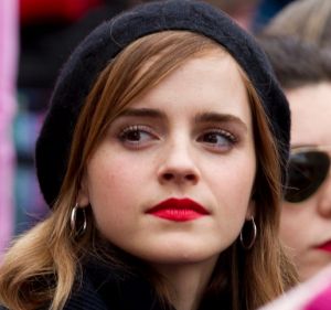 Actress Emma Watson sit with the crowd during the Women's March on Washington, Saturday, Jan. 21, 2017 in Washington. ...