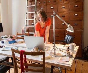 Woman working in home office | Simon Ritzmann/Getty Images