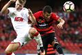 Stalemate: Riley McGree competes for the ball against Jaushua Sotirio.