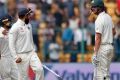 India's captain Virat Kohli, second right, gestures to Australia's Josh Hazlewood after their win.