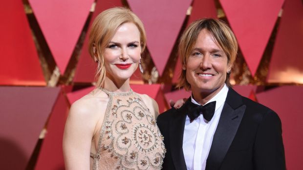 Nicole Kidman, wearing a feature red lip, and Keith Urban arrive at the Oscars on Sunday, Feb. 26, 2017, at the Dolby ...