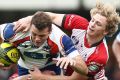 Paul Asquith of the Western Sydney Rams is tackled by Canberra Vikings player Joe Powell during an NRC match.