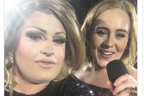 Adele impersonator feminem on stage with the real Adele at Domain Stadium.