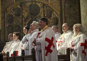 Members of the Knights Templar order attend a religious service in memory of Armenians killed by the Ottoman Turks, as Armenians mark the centenary of the mass killings, at the Armenian church in Bucharest, Romania,