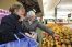 Two women shopping for food