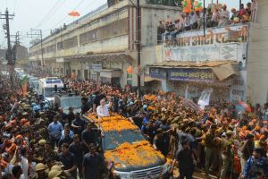 Indian Prime Minister Narendra Modi waves to supporters as he campaigns for his party in Varanasi, Uttar Pradesh.