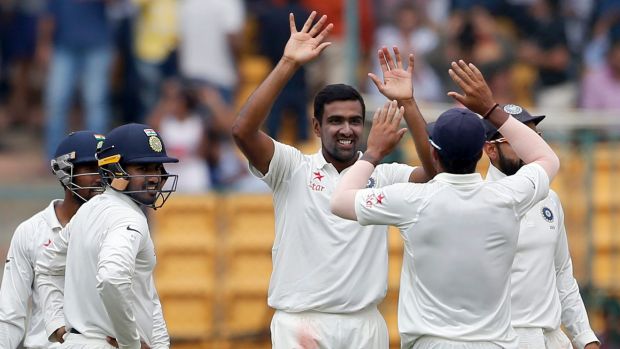 Ravi Ashwin celebrates the wicket of Mitch Marsh shortly before tea.