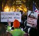 Protesters demonstrate against President Donald Trump's revised travel ban.