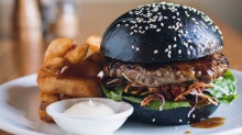 Rogue District's bulgogi burger in a charcoal bun.