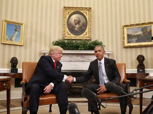 President Barack Obama and President-elect Donald Trump shake hands following their meeting in the Oval Office of the White House in Washington