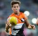 CANBERRA, AUSTRALIA - MARCH 10: Toby Greene of the Giants handles the ball during the JLT Community Series AFL match ...