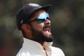 India's captain Virat Kohli celebrates the dismissal of England's Jos Buttler during their second day of the fifth ...