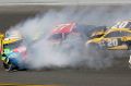 Erik Jones (77) and Matt Kenseth (20) collide with Kyle Busch (18).